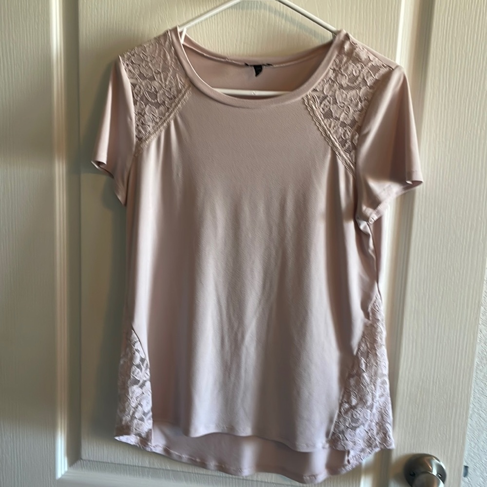 Women’s size medium blouse. 96% Polyester, 4% spandex and lace.